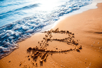 Icon bitcoin on golden sand, in background sea. Concept freelance, stock exchange.