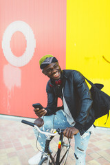 Fototapeta na wymiar African young man with fixed gear bicycle.