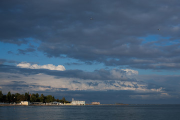 A beach and a sandy beach in the evening in Evpatoria, in Crimea. Sea gull