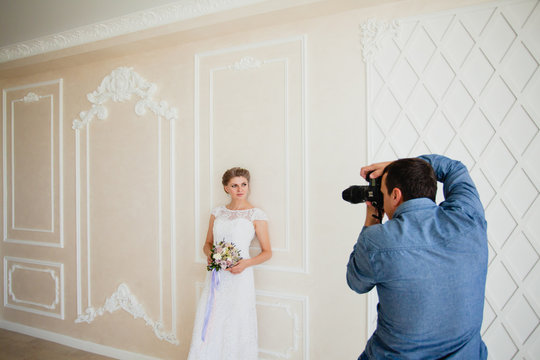 Photographer taking pictures the bride