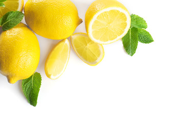 Fresh lemons and mint on white background