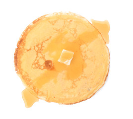 Delicious thin pancake with butter and honey on white background