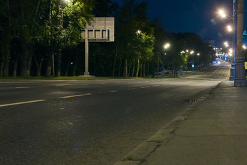 Automobile traffic on a city street at night