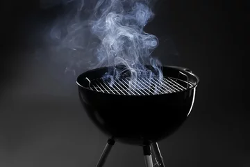 Poster Barbecue grill on dark background © Africa Studio