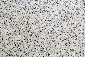 Artificial tile with small black dots