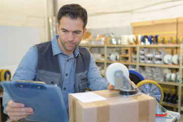 supply clerk reading the information