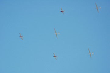 small airplane towing white glider - repetition