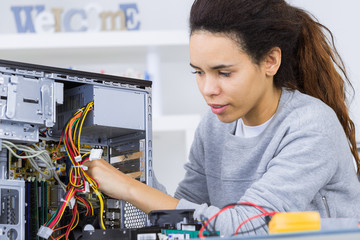 student girl in technology fixug computer hard drive