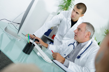 doctor and an assistant working together at the hospital