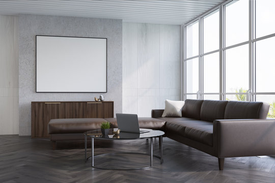 Gray living room, sofa and poster