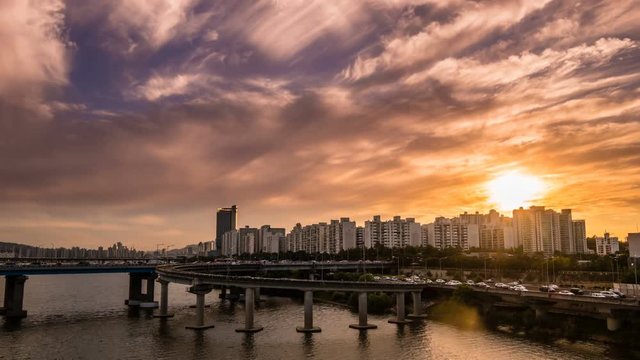 Sunset landscape between Hangang road and apartments where the intersection of Seoul and South Korea is visible. Shoot with Timelapse.
