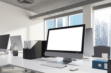 White screen computer monitor in office