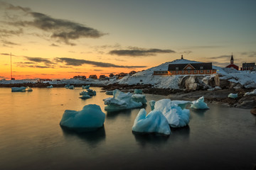 Nuuk city old harbor sunset view with icebergs, Greenland