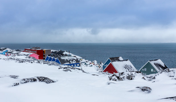 Colorful inuit houses and streets among the stones  in a suburb of arctic capital Nuuk