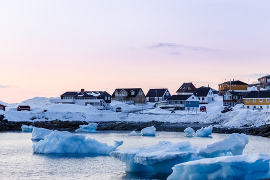 Nuuk city old harbor sunset view with icebergs, Greenland