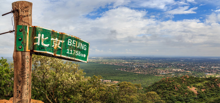 Signpost to Beijing on the hill near Gaborone city, Botswana