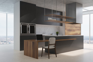 Black and wooden kitchen counter side view