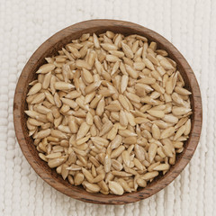 Sunflower seeds in a wooden bowl