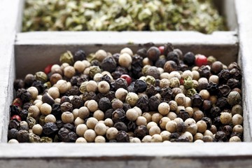Colourful pepper, peppercorns in a spice box