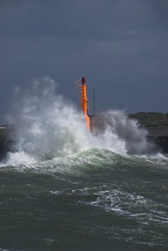 Strong waves with spray in a storm at the pier of Hvide Sande, Jutland, Denmark, Europe © imageBROKER