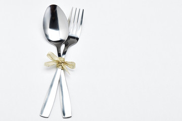 Fork and spoon with ribbon