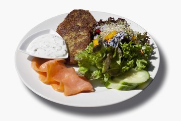 Potato fritters with smoked salmon, dip and a mixed salad