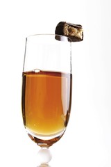 Glasses of sherry and a bitten off chocolate