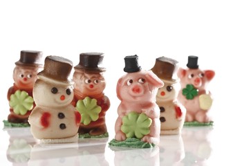 Lucky charms made of marzipan, pigs, snowmen, chimney sweeper