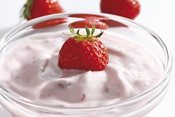 Strawberry yogurt in a glass bowl