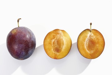 Plums, whole and halved