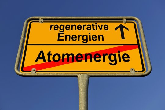 Symbolic image in the form of a town sign, in German, exit from atomic energy, entrance into regenerative energy sources