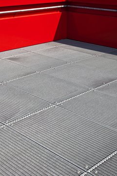 Steel platform with a red rail, observation deck