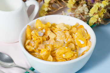 Corn flakes in a bowl with fresh milk for eating in the morning,breakfast or meal