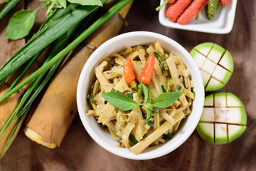 Northern Thai food (Yum Nor Mai),spicy bamboo shoot salad with crab paste on wooden background.Top...