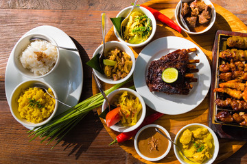 Traditional balinese sea food with satay and curry in Bali, Indonesia - 174784443