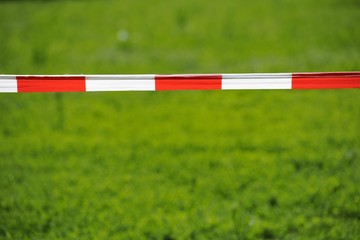 Bandrole, warning tape, red and white, front lawn