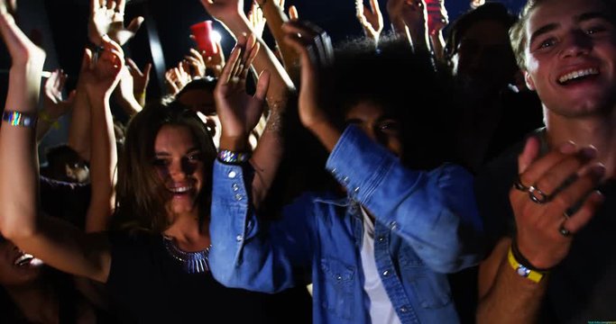 Group of African American and mixed-race people dancing at a concert 