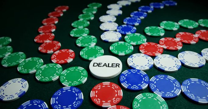 Casino chips arranged on poker table 