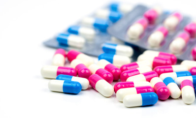 Obraz na płótnie Canvas Colorful of antibiotic capsules pills selective focus on blur background with copy space. Drug resistance, antibiotic drug use with reasonable, health policy and health insurance concept.
