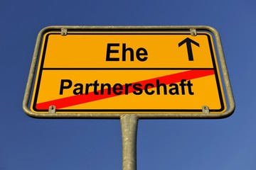 City limit sign, symbolic image in German for contradiction between partnership and marriage