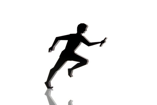 Silhouette of a relay runner