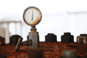 Pressure gauge using measure the pressure in production process. Worker or Operator monitoring oil...