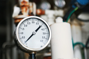 Pressure gauge using measure the pressure in production process. Worker or Operator monitoring oil...