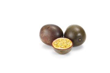 Two passion fruits and a halved one