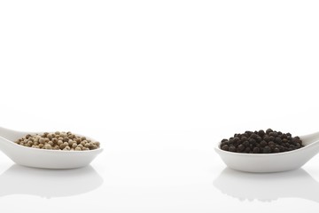 Peppercorn in porcelain spoons