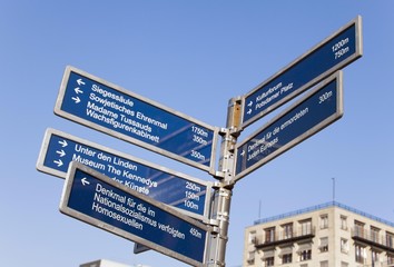 Fototapeta premium Signpost at the Brandenburg Gate, city centre, Berlin, Germany, Europe