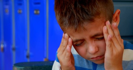 Schoolboy suffering from headache 