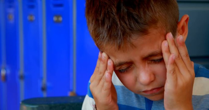 Schoolboy suffering from headache 