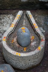 Stone lingam, phallic symbol for Shiva, Heritage Hotel Ahilya Fort, Maheshwar, Madhya Pradesh, India, Asia