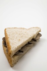 US twenty-five cent coins on sandwich half
